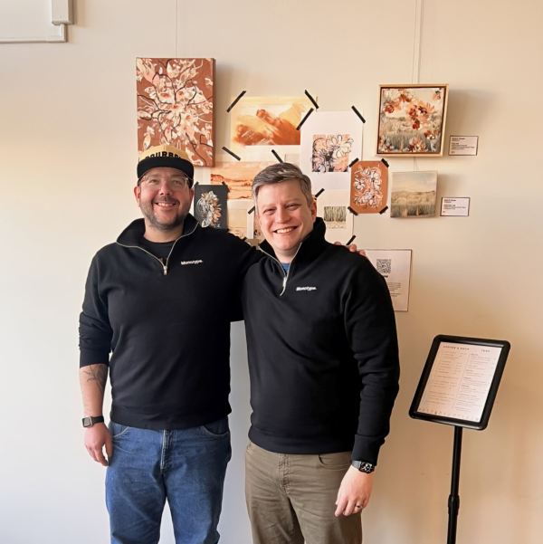 Phil C-B and Terrance W stand together in matching Monotype shirts.